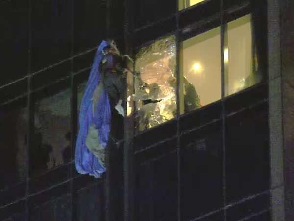Base jumper rescue sees $20k glass panel smashed at hotel